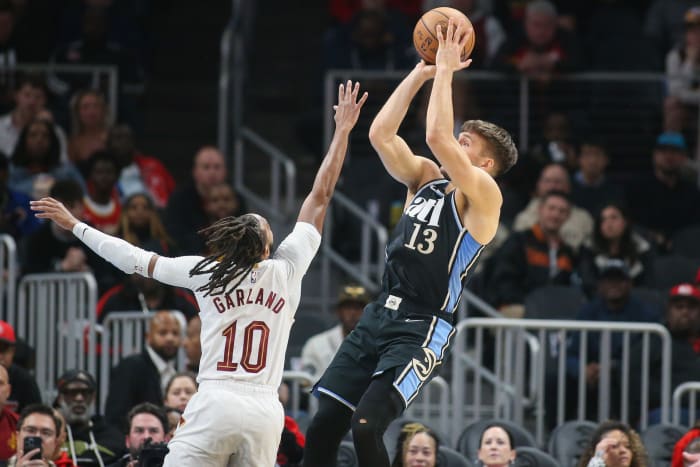 Mar 6, 2024; Atlanta, Georgia, USA; Atlanta Hawks guard Bogdan Bogdanovic (13) shoots over Cleveland Cavaliers guard Darius Garland (10) in the first quarter at State Farm Arena. Mandatory Credit: Brett Davis-USA TODAY Sports